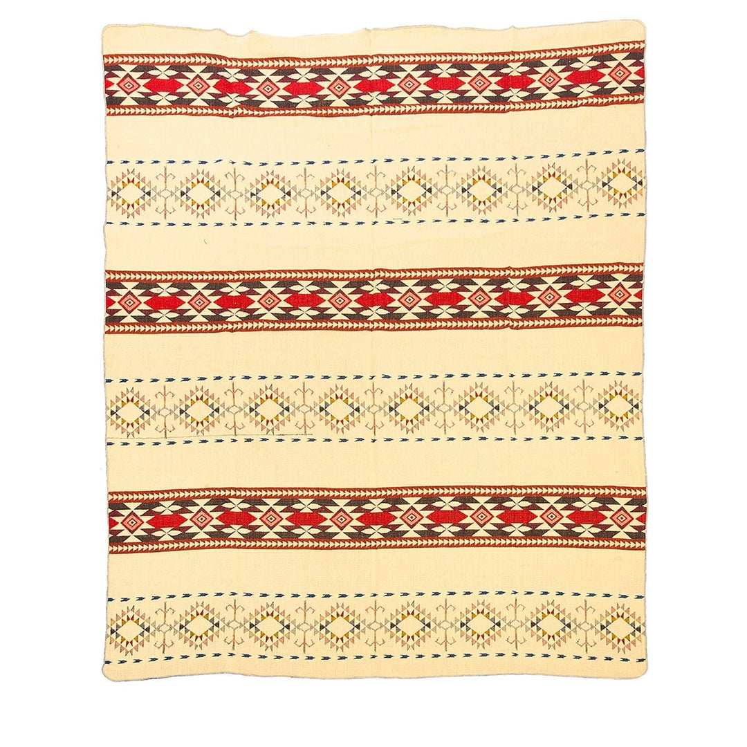 Ganze Ansicht der Rückseite der Alpaka-Decke 'Cotopaxi Mehrfarbig' mit Blau- und Türkistönen auf dunklem Hintergrund.