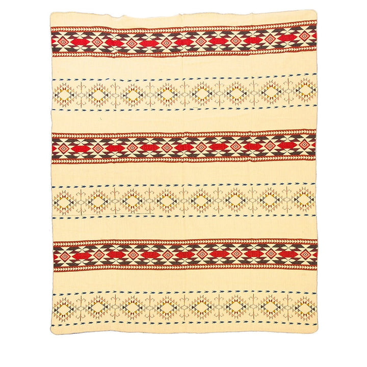 Ganze Ansicht der Rückseite der Alpaka-Decke 'Cotopaxi Mehrfarbig' mit Blau- und Türkistönen auf dunklem Hintergrund.