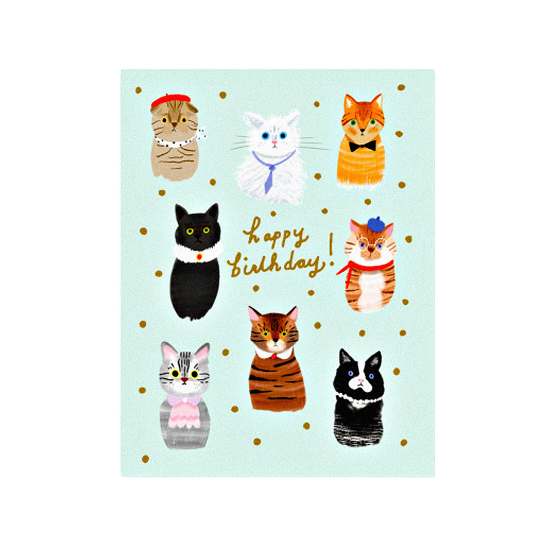 Geburtstagskarte mit „Happy Birthday“-Schriftzug, neun Katzen mit Partyhüten auf mintgrünem Hintergrund und goldenen Punkten.