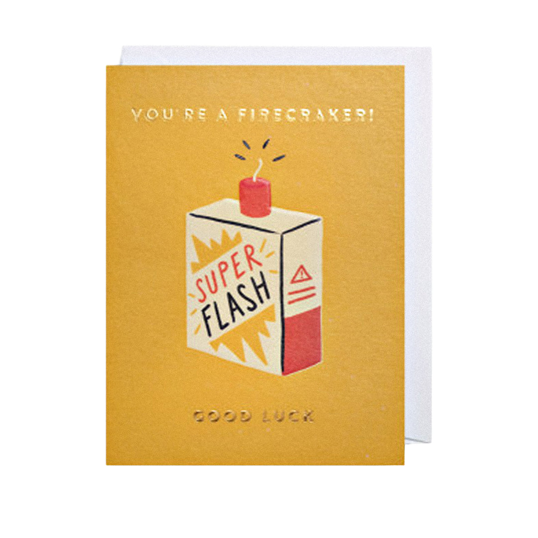 Glückwunschkarte mit „You’re a firecracker Good luck“-Schriftzug und dynamischer Illustration.