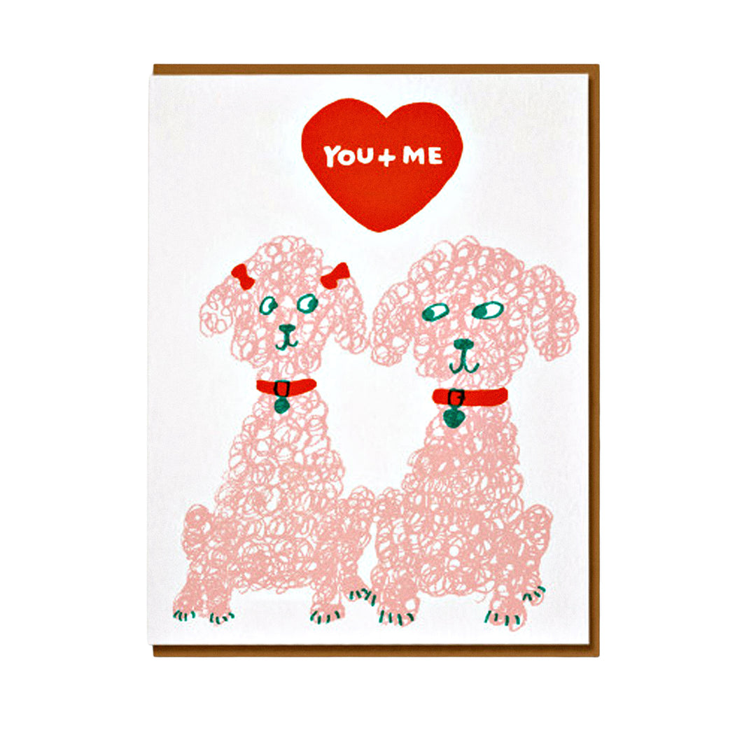 Grußkarte mit zwei Pudeln und „You + Me“-Schriftzug.