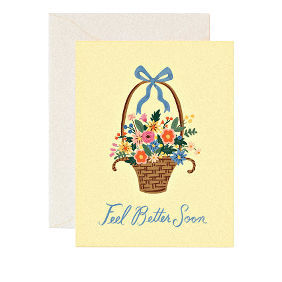 Gute-Besserung-Karte mit „Feel better soon“-Schriftzug und Blumenkorb.