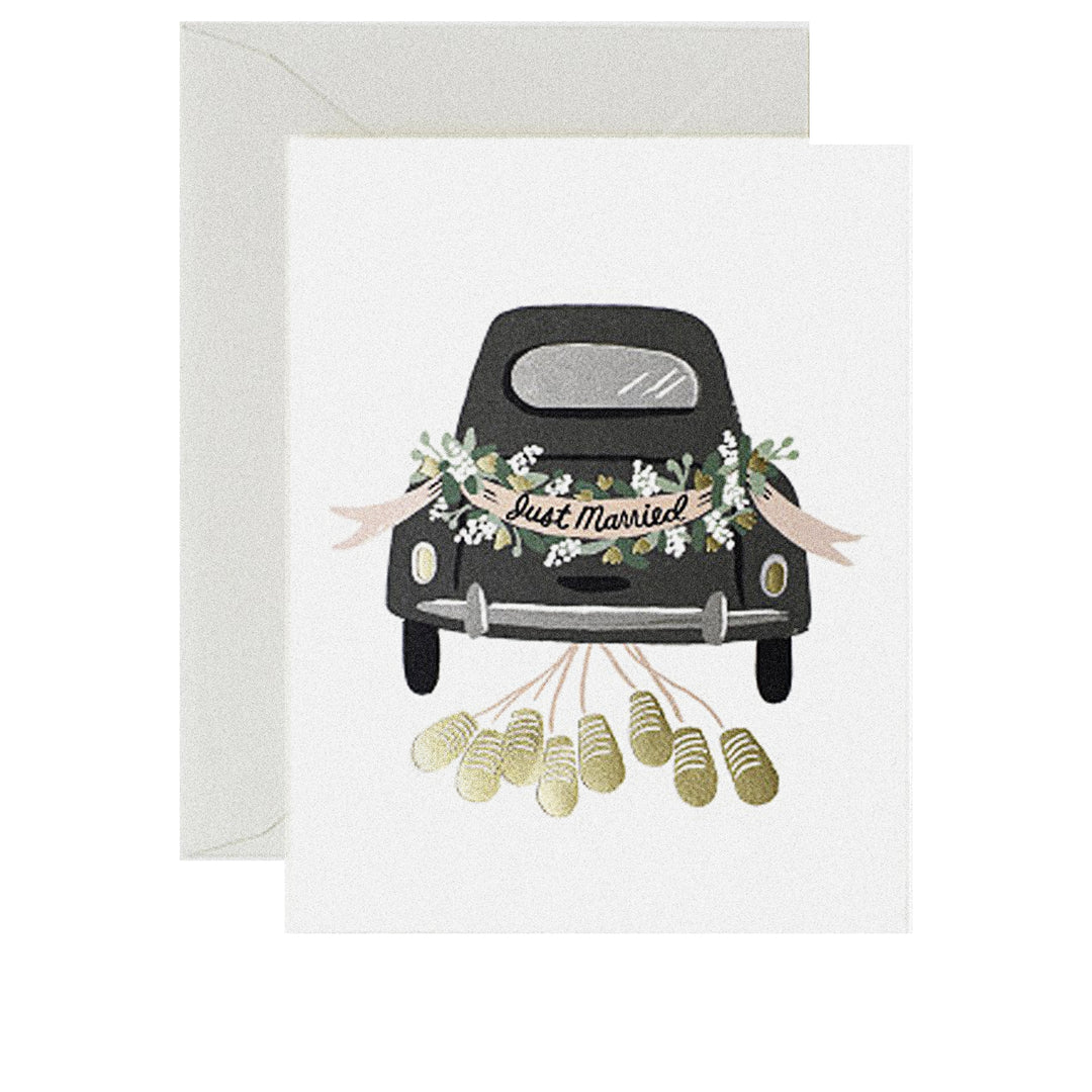 Hochzeitskarte mit „Just married“-Hochzeitsauto und klappernden Dosen.