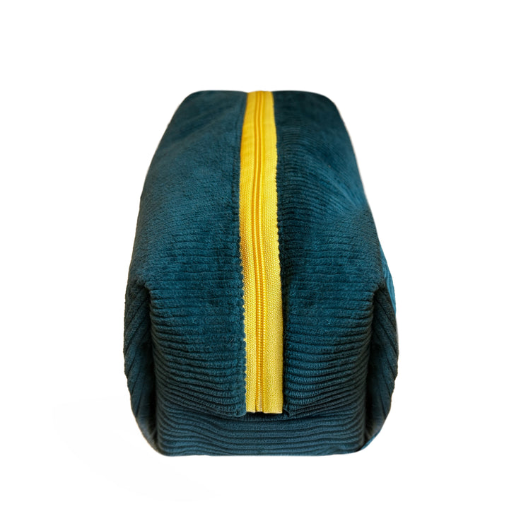 Elegante Kosmetiktasche aus türkisen Kord mit gelbem Reißverschluss