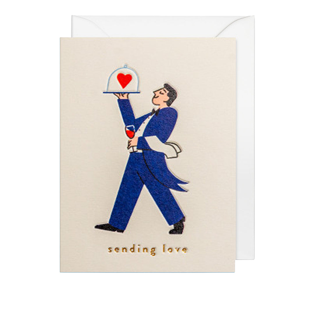 Liebeskarte mit elegantem Kellner in blauem Anzug, der ein Tablett mit Herz serviert, und dem Schriftzug „sending love“.