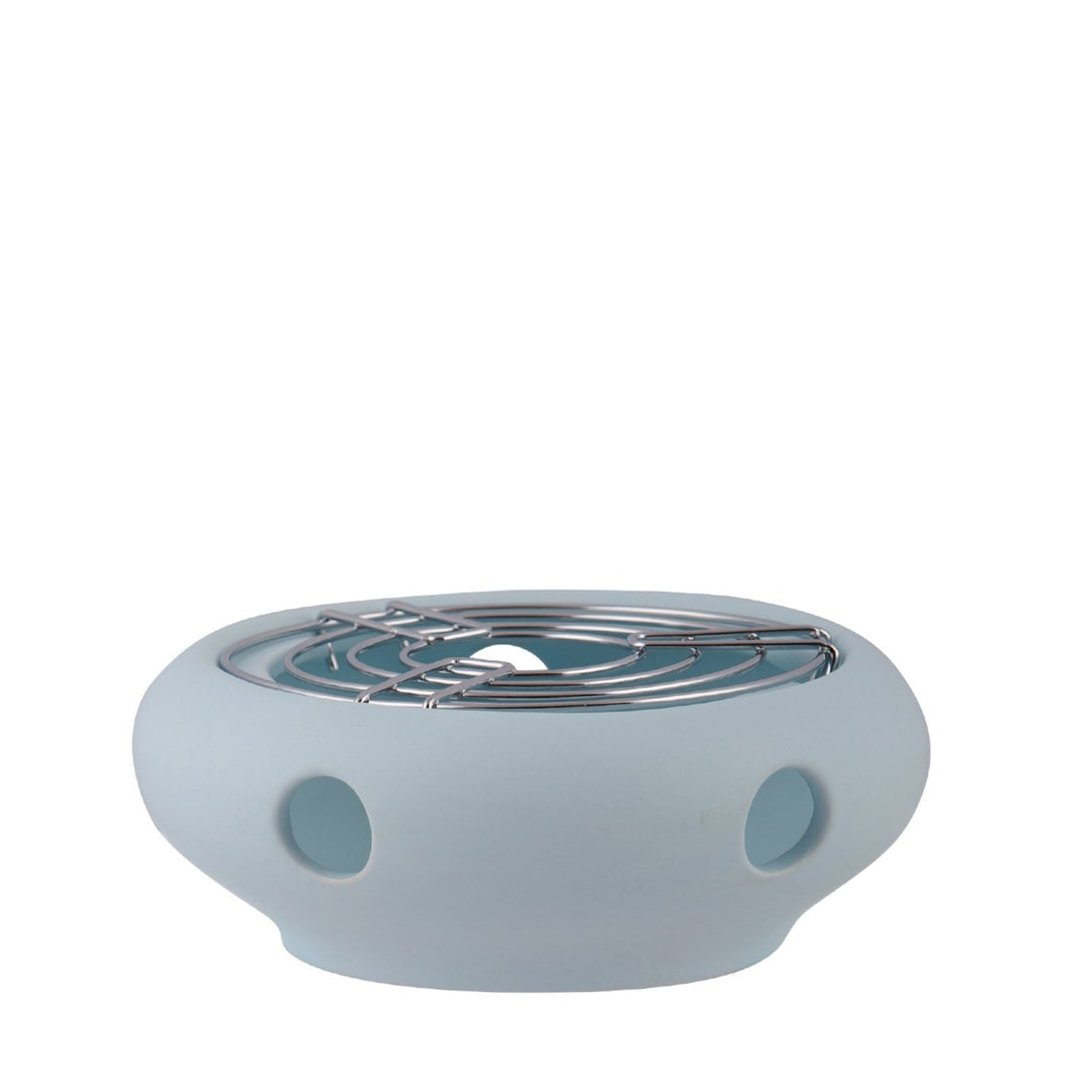 Eisblaues Keramik-Teestövchen mit Metall-Gitterrost, hält Kannen warm.