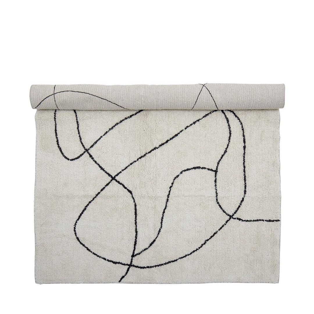Teppich in Creme mit schwarzem abstraktem Linienmuster