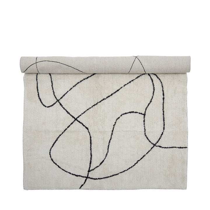 Teppich in Creme mit schwarzem abstraktem Linienmuster