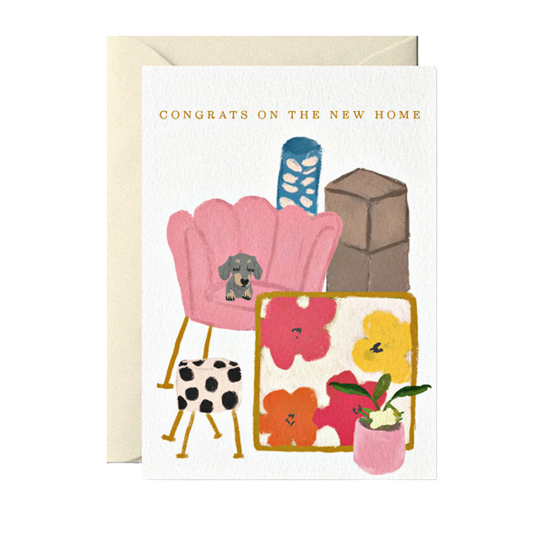 Umzugskarte mit „Congrats on the new home“, Sessel und Hundemotiv.